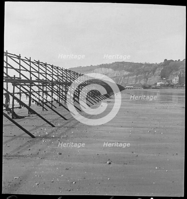 Looking south along a line of Admiralty scaffolding, Shanklin beach, Isle Of Wight, 1940-46.  Creator: George R Long.