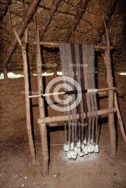 Loom with chalk loom weights, Butser Iron Age Farm, c20th century. Artist: CM Dixon.