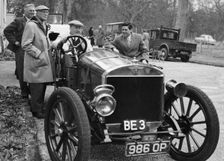 Lord Brabazon in the driver's seat of a vintage car, 1956