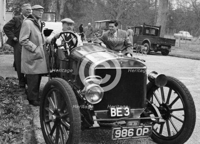 Lord Brabazon in the driver's seat of a vintage car, 1956. Artist: Unknown