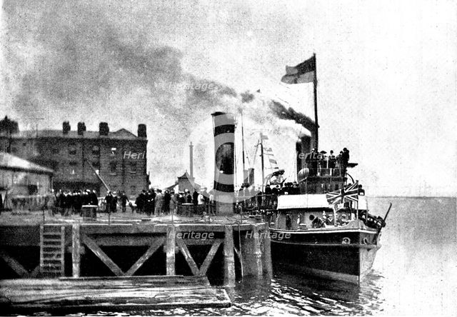Lord Charles Beresford's party at Portsmouth: M.P.s...en route for Whale Island, 1898. Creator: Russell & Sons.