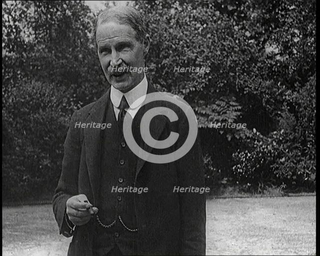 Lord Privy seal Andrew Bonar Law Standing in a Garden, 1921. Creator: British Pathe Ltd.