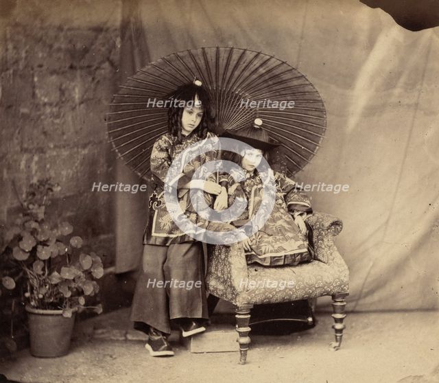 Lorina and Alice Liddell in Chinese Dress, 1860. Creator: Lewis Carroll.