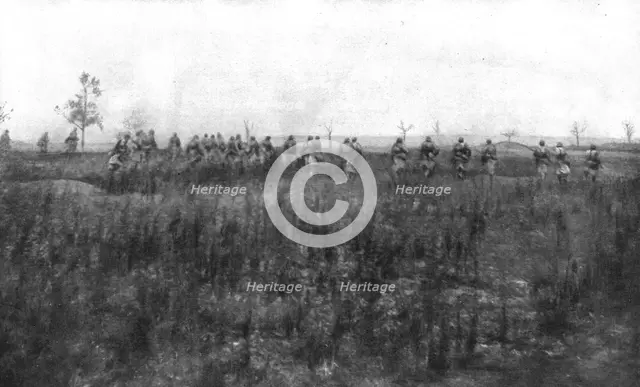 'La bataille de Champagne; En terrain conquis: les troupes de poursuite suivent les troupes d'assaut Creator: Unknown.