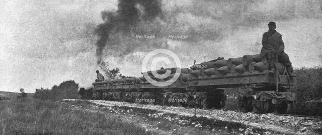''La Bataille de la Somme; Projectiles d'artillerie lourde transportes vers le front', 1916. Creator: Unknown.