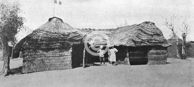 'La grande guerre en Afrique; le drapeau francais flotte sur la case du lieutenant..., c1916. Creator: Unknown.