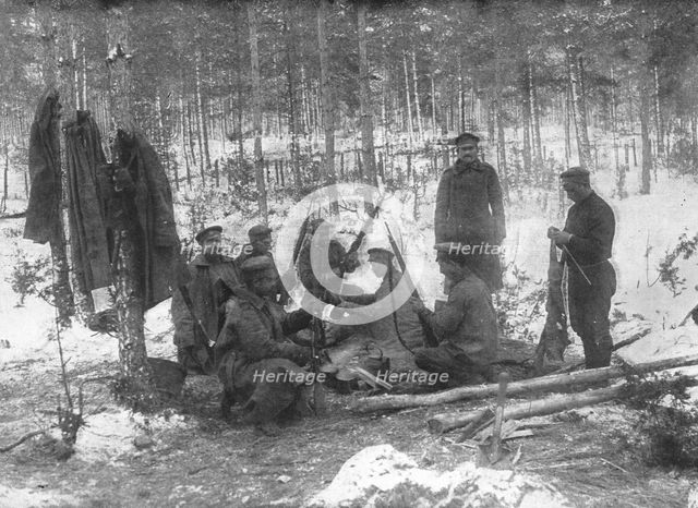 ''La Diversion Russe de Bukovine, Petrograd, janvier 1916; Soldats russes nettoyant leurs armes en p Creator: Pierre Ctsoup.