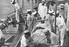 La fin de L "Emden"; Les blesses de "Emden" sont embarques a bord du "Sydney" 1914. Creator: Unknown