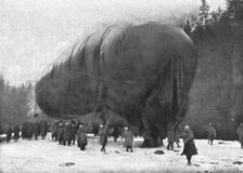 La "Saucisse"; Avant l'ascension : "-- Sous son ventre ride de gros saurien, pend son…." 1916. Creator: Unknown
