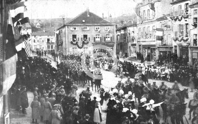 'La patrie retrouvee; A Morhange, le 18 novembre: de jeunes Lorraines fleurissent les..., 1918. Creator: Unknown.