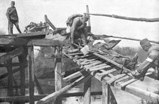 La tragique retraite Serbe; Le transport des blesses sur la rive droite de la..., 1915 (1924). Creator: Vladimir Betzitch