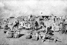 'La Turquie Succombe; L'inspection des selles des chameaux employes aux transports 1918. Creator: Unknown