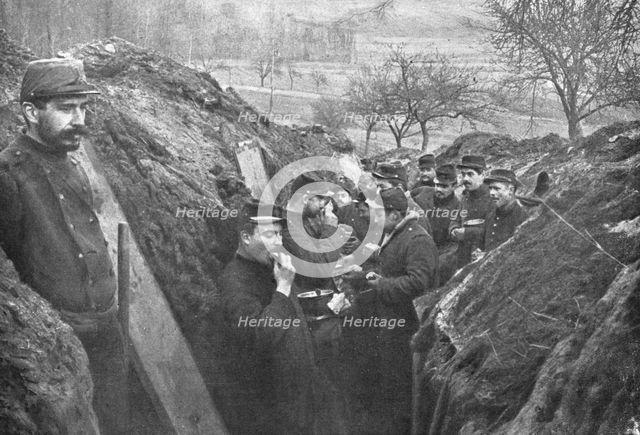 'La vie en Campagne; On la mange souvent debout et a la hate, le fusil a portee de la main', 1914. Creator: Unknown.