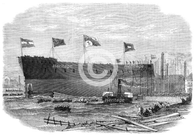 Launch of the Victoria, iron-clad frigate built for the Queen of Spain at Blackwall, 1865. Creator: Smyth.