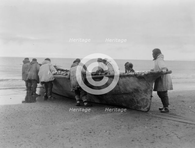 Launching the whale boat-Cape Prince of Wales, c1929. Creator: Edward Sheriff Curtis.