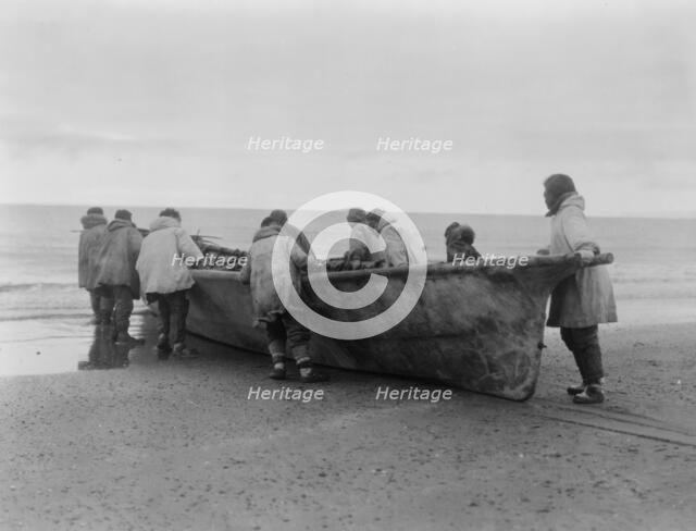 Launching the whale boat-Cape Prince of Wales, c1929. Creator: Edward Sheriff Curtis.