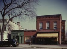 Laundry, barbershop and store, Washington, D.C.?, between 1941 and 1942. Creator: Louise Rosskam