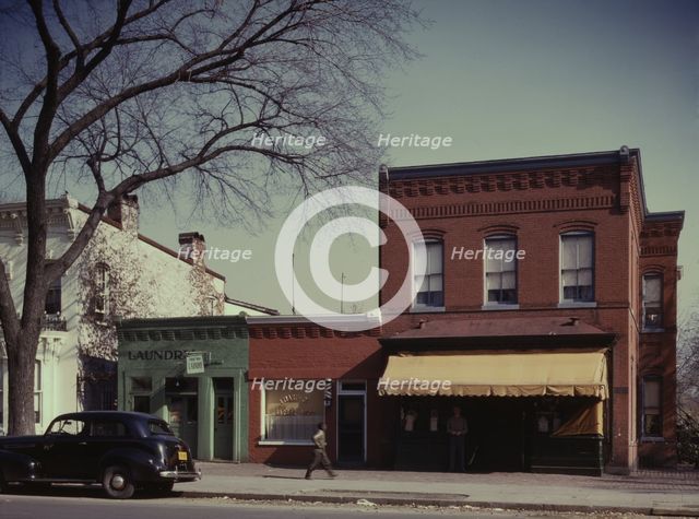 Laundry, barbershop and store, Washington, D.C.?, between 1941 and 1942. Creator: Louise Rosskam.