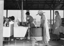Laundry facilities in FSA migrant labor camp, Westley, California, 1939. Creator: Dorothea Lange