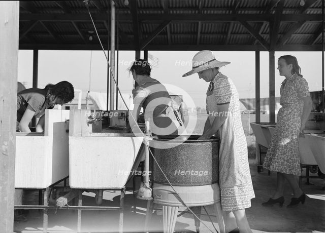 Laundry facilities in FSA migrant labor camp, Westley, California, 1939. Creator: Dorothea Lange.