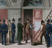 Law enforcement officers removing the inscription from the door of the Irish National Land...1881. Creator: Unknown