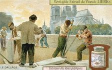 Laying paving slabs in a Paris street, c1900