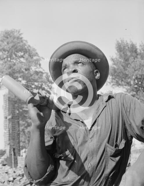 Laborer listening to instructions of wrecking company foreman..., Washington, D.C, 1942. Creator: Gordon Parks.