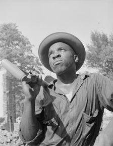 Laborer listening to instructions of wrecking company foreman..., Washington, D.C, 1942. Creator: Gordon Parks