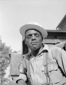 Laborer listening to instructions being given by a section foreman, Washington, D.C, 1942. Creator: Gordon Parks