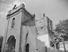 Laborers wrecking buildings on Independence Avenue, Washington, D.C, 1942. Creator: Gordon Parks