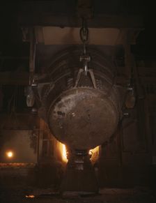 Ladle of molten iron is poured into..., Allegheny Ludlum Steele Corp., Brackenridge, Pa., (1941?). Creator: Alfred T Palmer