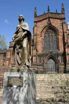 Lady Wulfrun statue and St Peter's Church, Wolverhampton, West Midlands. Creator: Peter Thompson