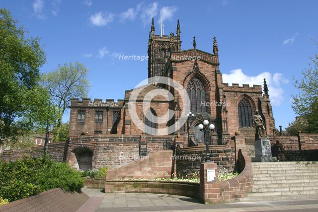 Lady Wulfrun statue and St Peter's Church, Wolverhampton, West Midlands. Creator: Peter Thompson.