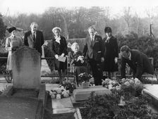 Lady Churchill and family lay a wreath on the grave of Sir Winston Churchill, Bladon, 1974