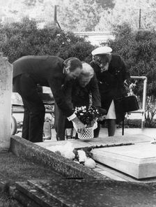 Lady Churchill laying a wreath on the grave of Sir Winston Churchill, Bladon, Oxfordshire, 1974. Creator: Unknown