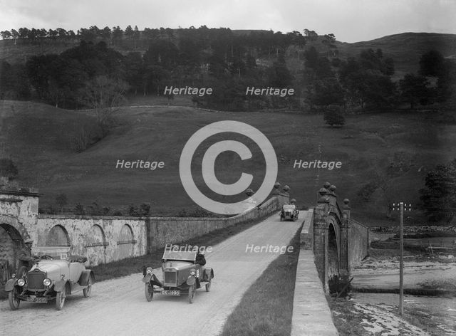 Lagonda of WH Oates, Calcott open tourer and Wolseley at the Scottish Light Car Trial, 1922. Artist: Bill Brunell.