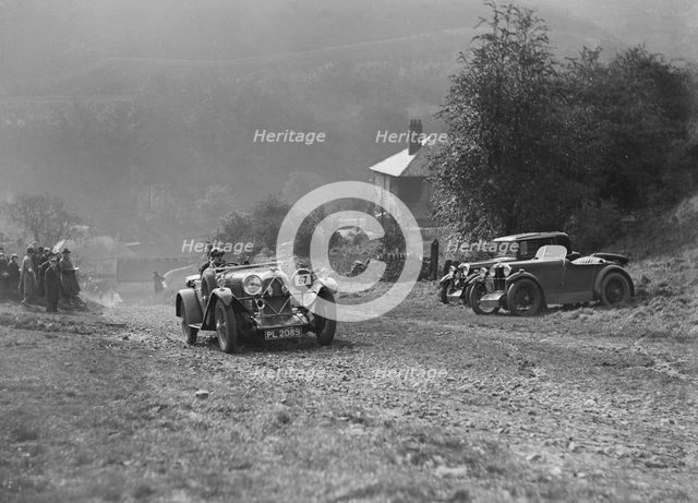 Lagonda of Lord de Clifford passing two MG M types during the MCC Sporting Trial, 1930. Artist: Bill Brunell.