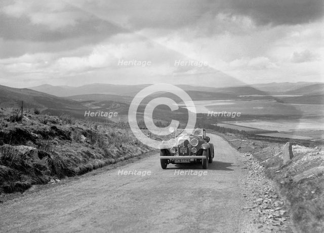 Lagonda open tourer of CG Seddon competing in the RSAC Scottish Rally, 1934. Artist: Bill Brunell.