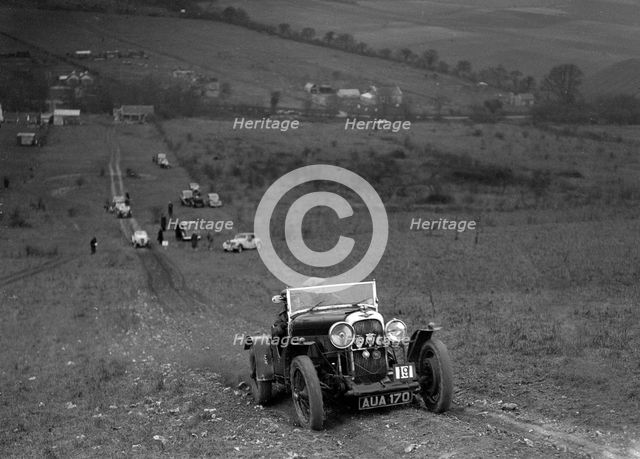 Lagonda Rapier competing in the London Motor Club Coventry Cup Trial, Knatts Hill, Kent, 1938. Artist: Bill Brunell.