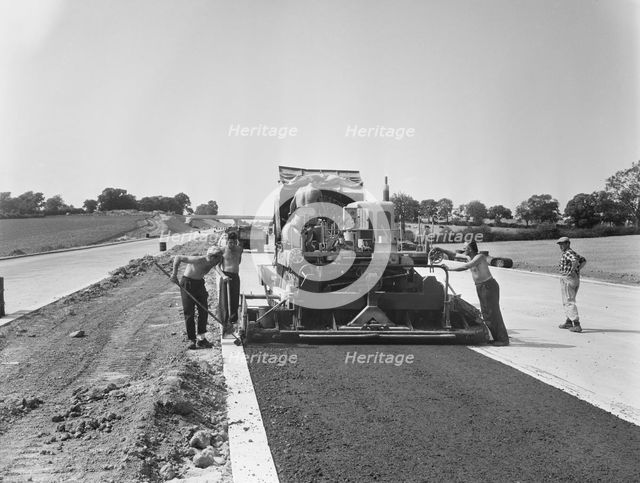 Laing workers operating a paver machine, London to Yorkshire Motorway (M1, 22/07/1959. Creator: John Laing plc.