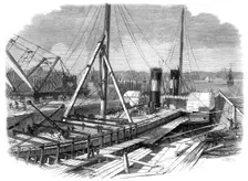 Laird's Graving Docks at Birkenhead: the Hibernia under repair, 1861. Creator: Unknown