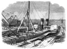 Laird's Graving Docks at Birkenhead: the Hibernia under repair, 1861. Creator: Unknown