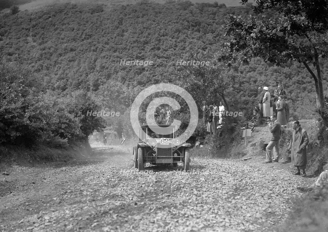 Lancia Lambda saloon competing in the Mid Surrey AC Barnstaple Trial, Beggars Roost, Devon, 1934. Artist: Bill Brunell.