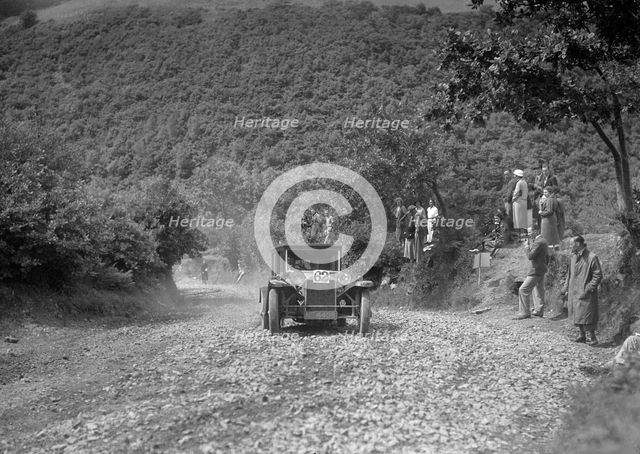 Lancia Lambda saloon competing in the Mid Surrey AC Barnstaple Trial, Beggars Roost, Devon, 1934. Artist: Bill Brunell.