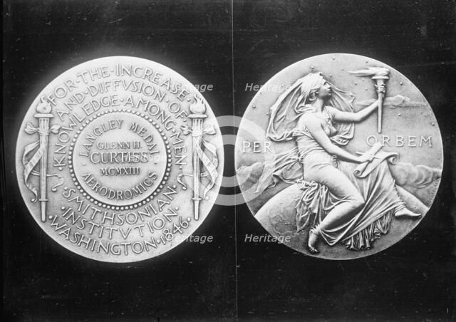 Langley Medal presented to aviator Glenn Hammond Curtiss, 1913. Creator: Harris & Ewing.