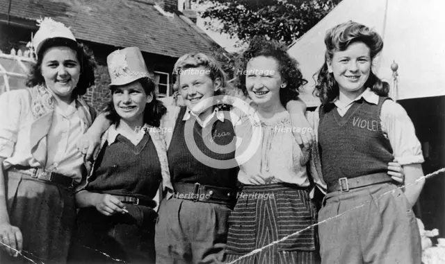 Land Army Girls outside Woodhill Road Hostel, Collingham, Nottinghamshire, c1947-1950. Creator: Unknown.