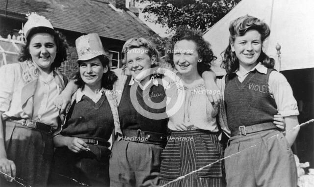 Land Army Girls outside Woodhill Road Hostel, Collingham, Nottinghamshire, c1947-1950. Artist: Unknown