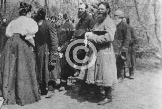 Landowner giving the Paschal greeting to her peasants, Russia, 1890s. Artist: Unknown