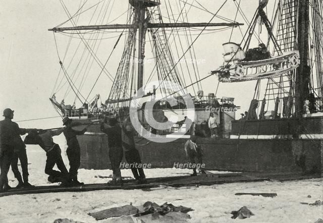 'Landing a Motor-Sledge', c1910–1913, (1913). Artist: Herbert Ponting.