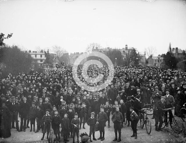 Large crowd on the bridge on May Morning to hear the college choir, Magdalen Bridge, Oxford, 1895. Creator: Henry Taunt.